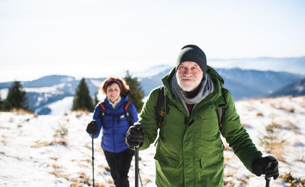 Couple utilizing safe hiking practices